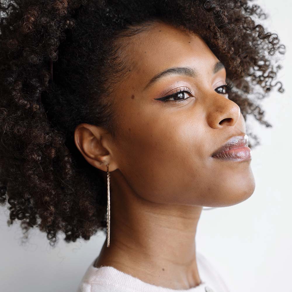 portrait of a beautiful black woman with afro hair 4udcemw.jpg