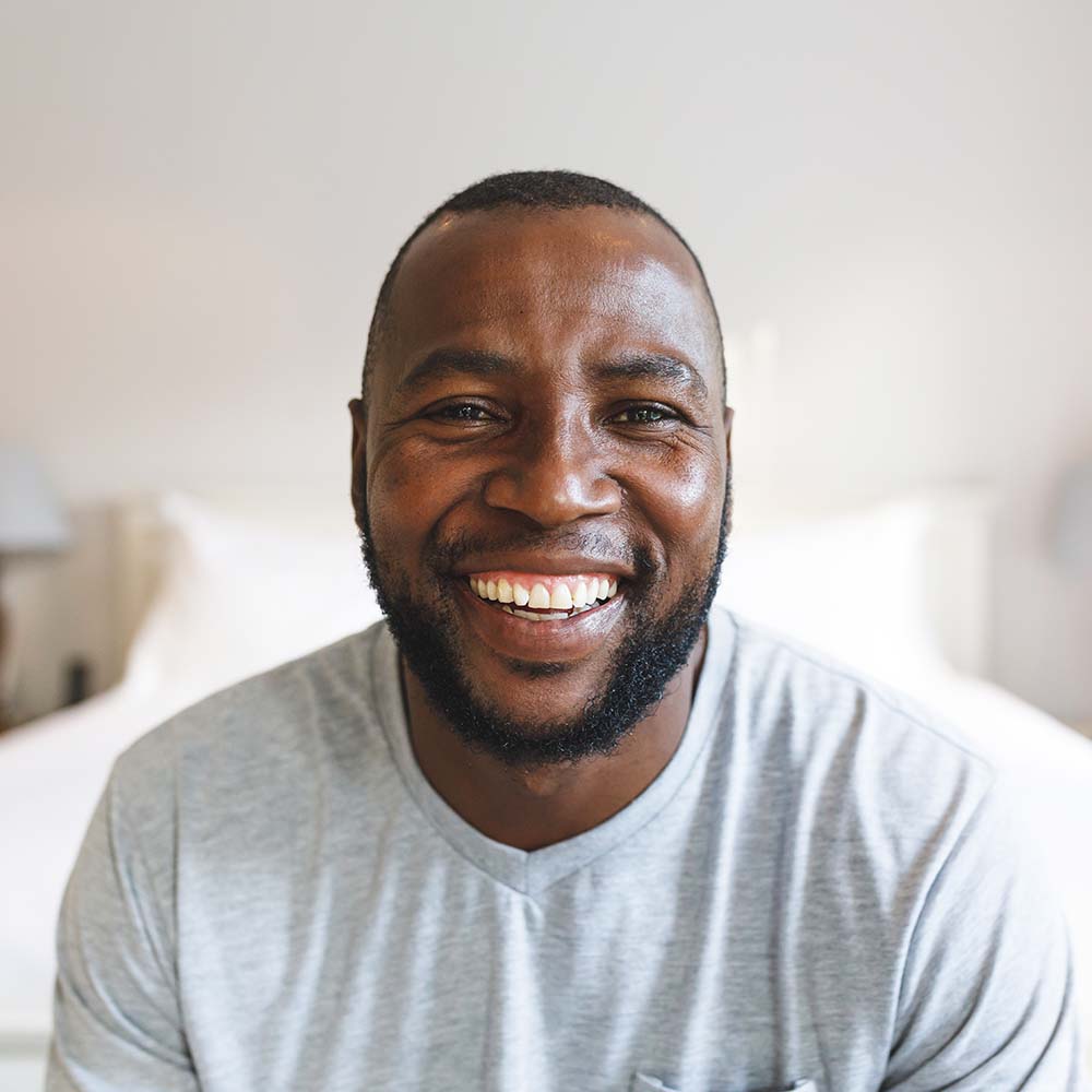 portrait of happy african american man looking at ky33eht.jpg